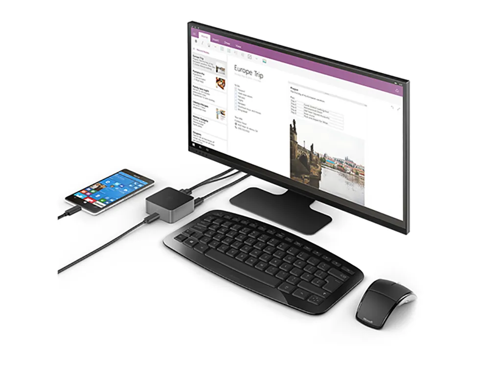 A Windows phone connected to a docking station, used as a desktop computer.
